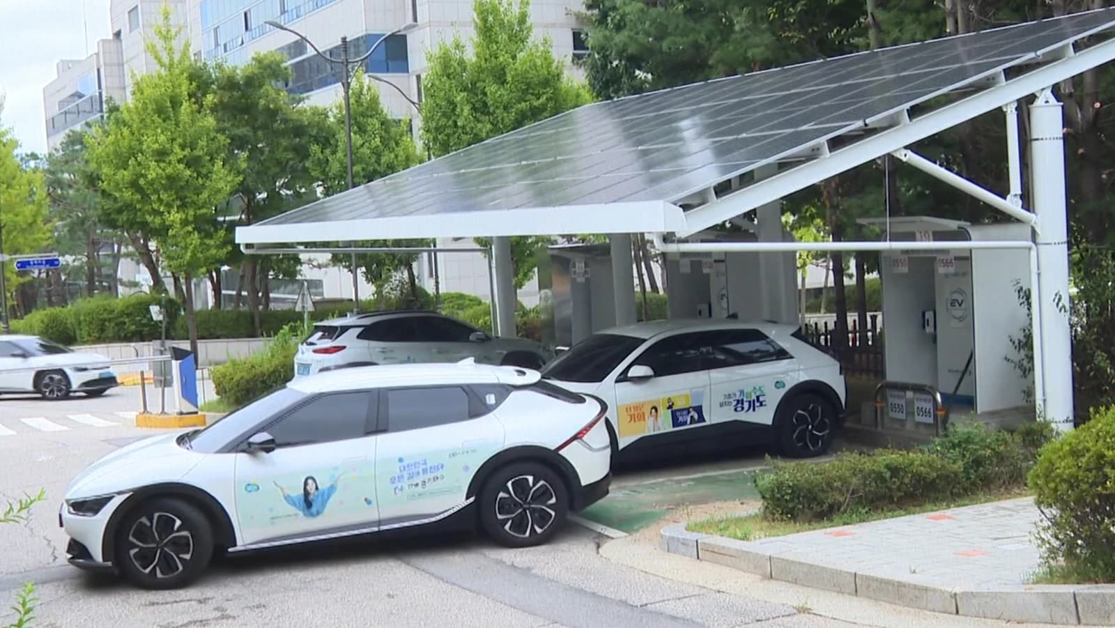 Electric vehicle charging station under a solar canopy in South Korea.