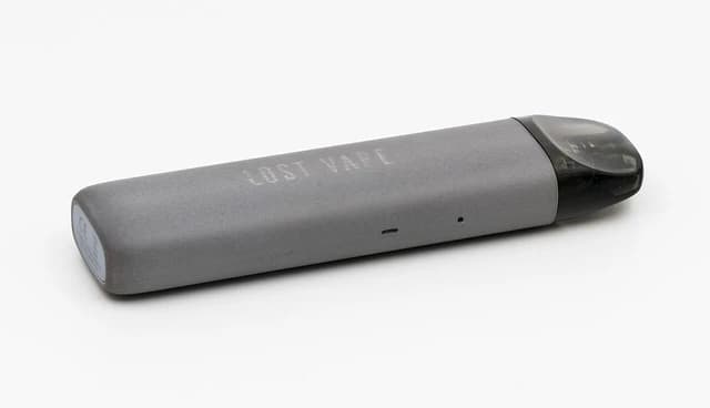 A gray Lost Vape Ursa Nano pod system for vaping is shown on a white background.