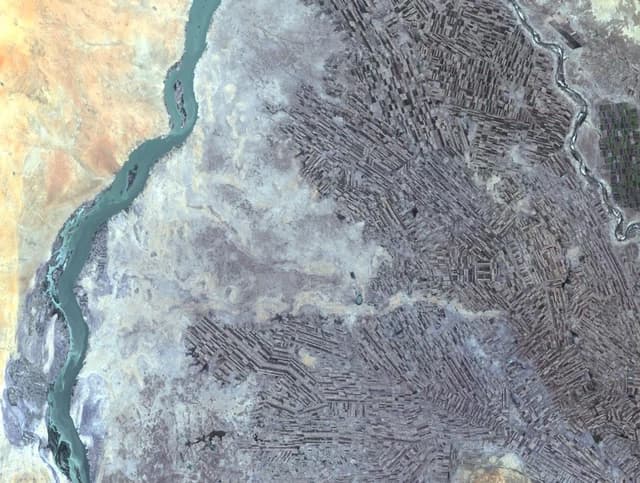 Satellite image showing agricultural fields alongside the Nile River in Sudan.