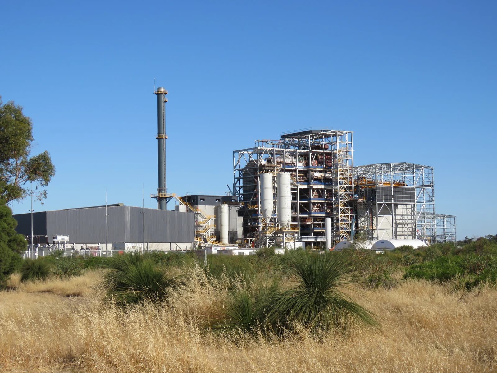 East Rockingham Waste to Energy Plant with a tall chimney under a clear sky.