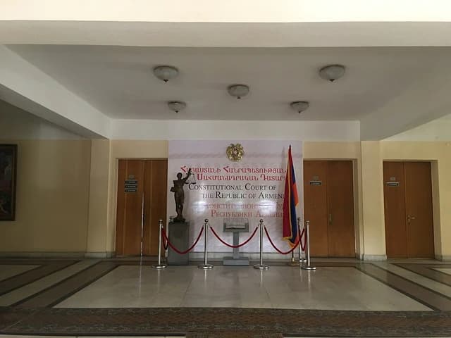 Entrance hall with a banner for the Constitutional Court of the Republic of Armenia.