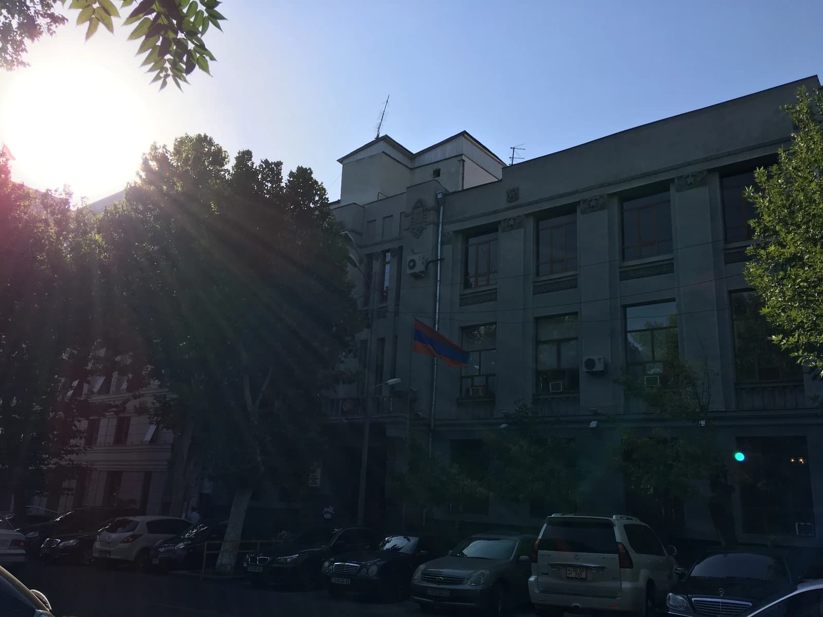 Exterior view of the Prosecutor General's Office in Armenia with a flag.