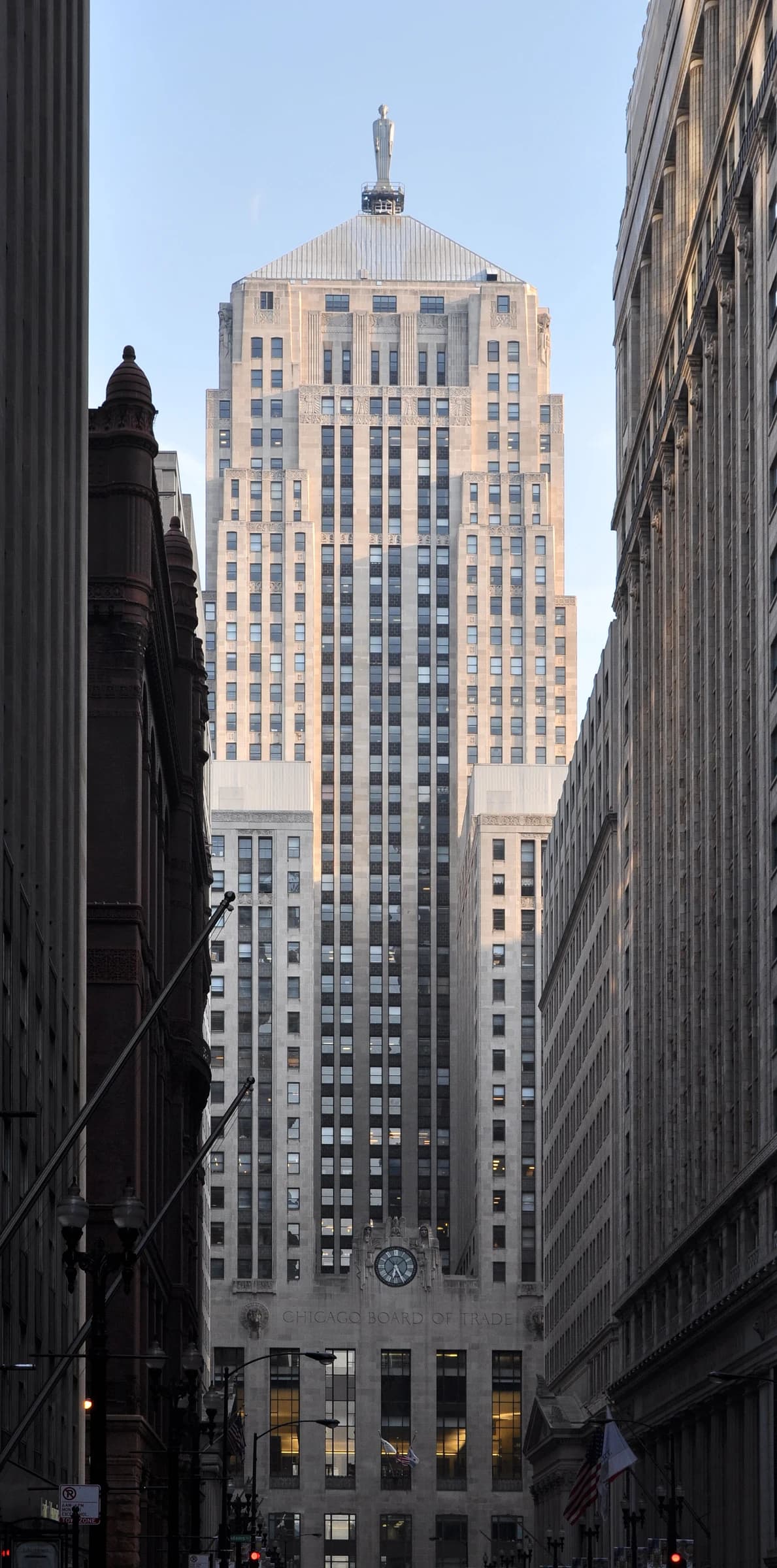 Chicago Board of Trade Building, an Art Deco skyscraper, seen from a street canyon.