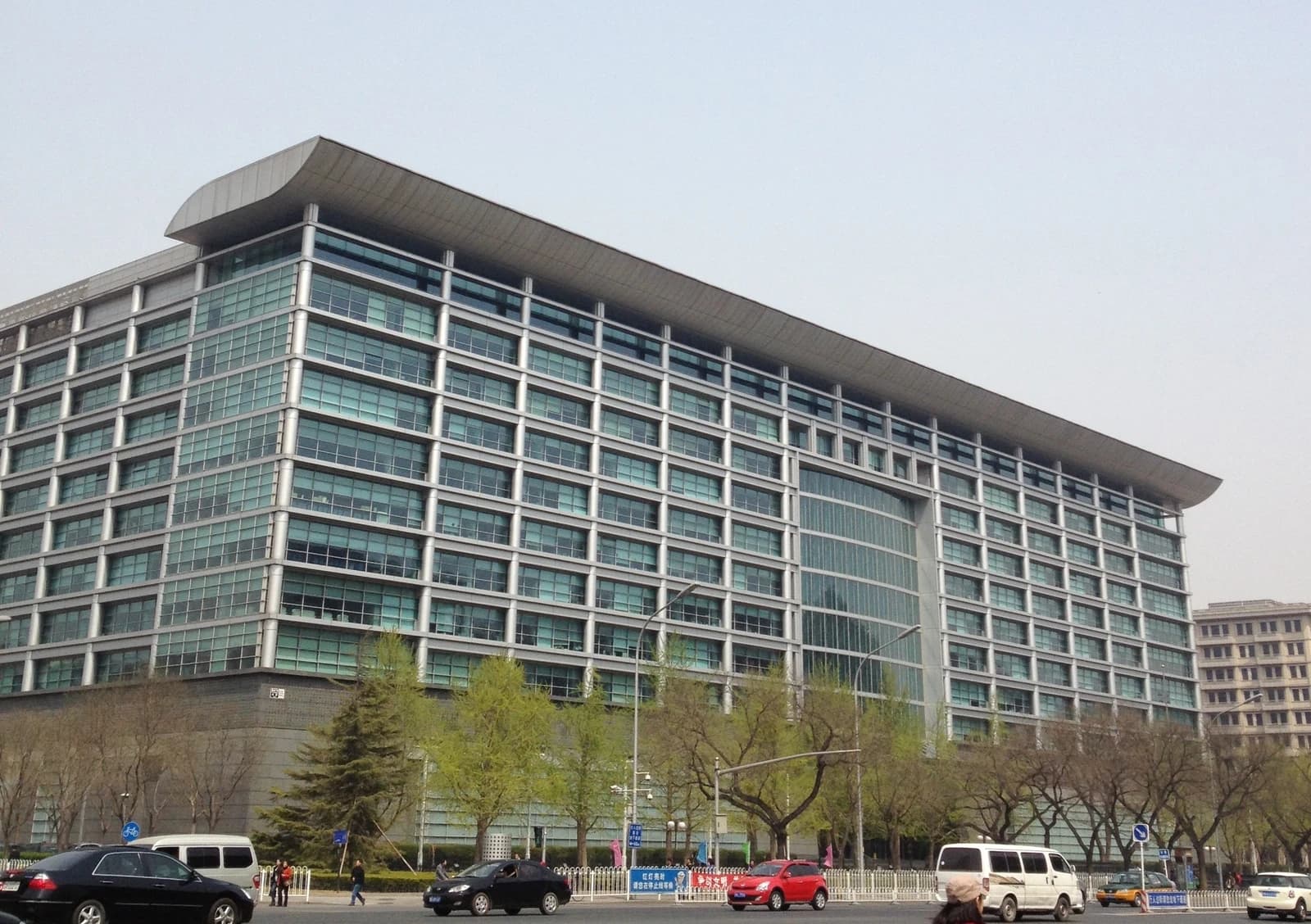 Industrial and Commercial Bank of China building with traffic on Changan Avenue, Beijing.