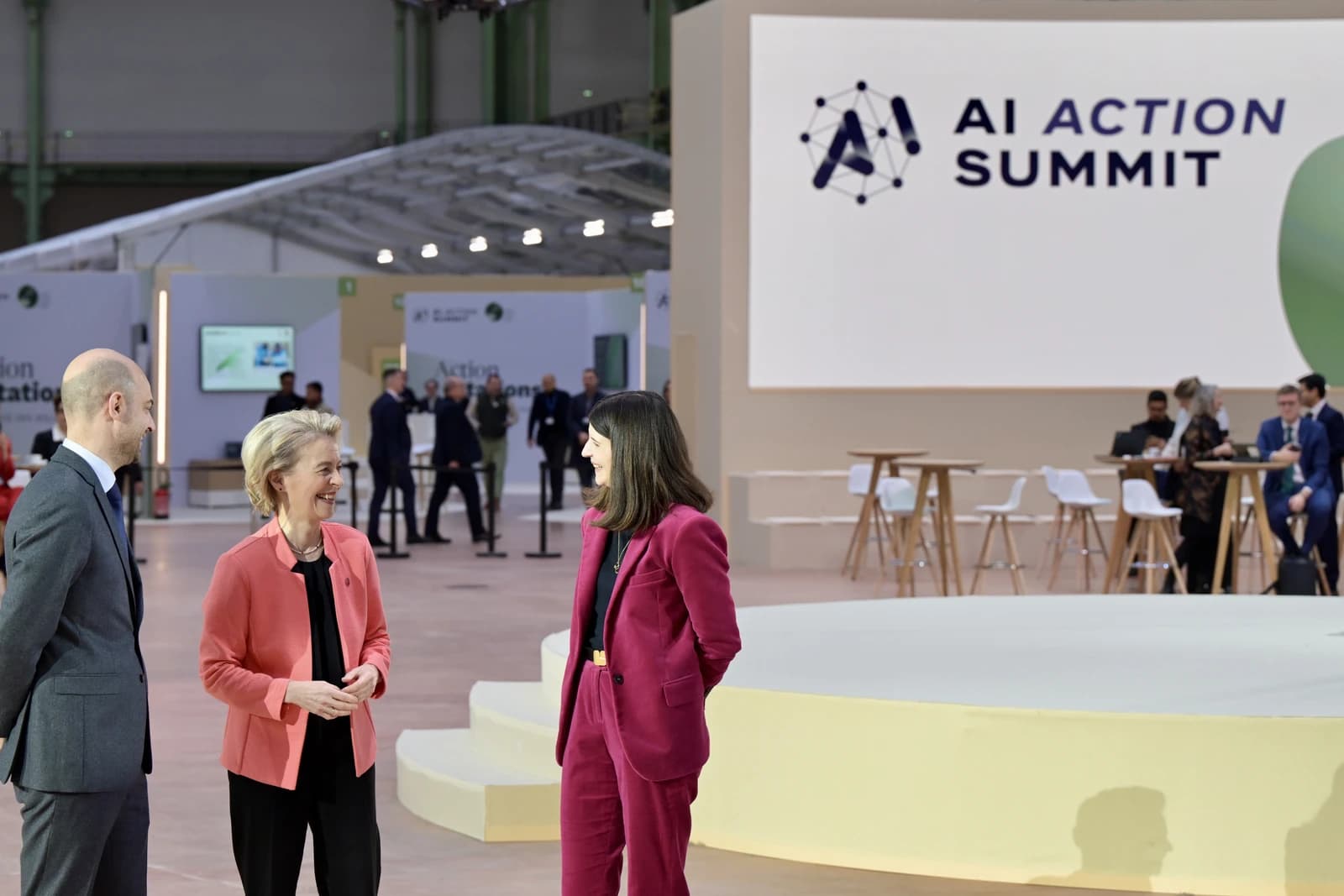 Jean-Noël Barrot, Ursula von der Leyen, and Clara Chappaz standing and speaking at an AI Action Summit in Paris.