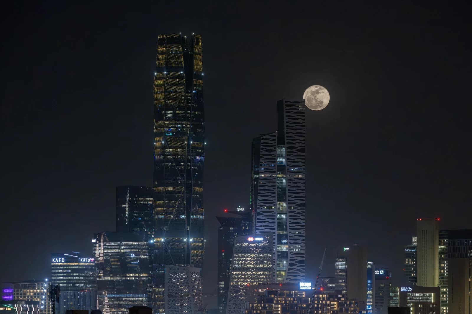 Skyscrapers of King Abdullah Financial District in Riyadh at night.