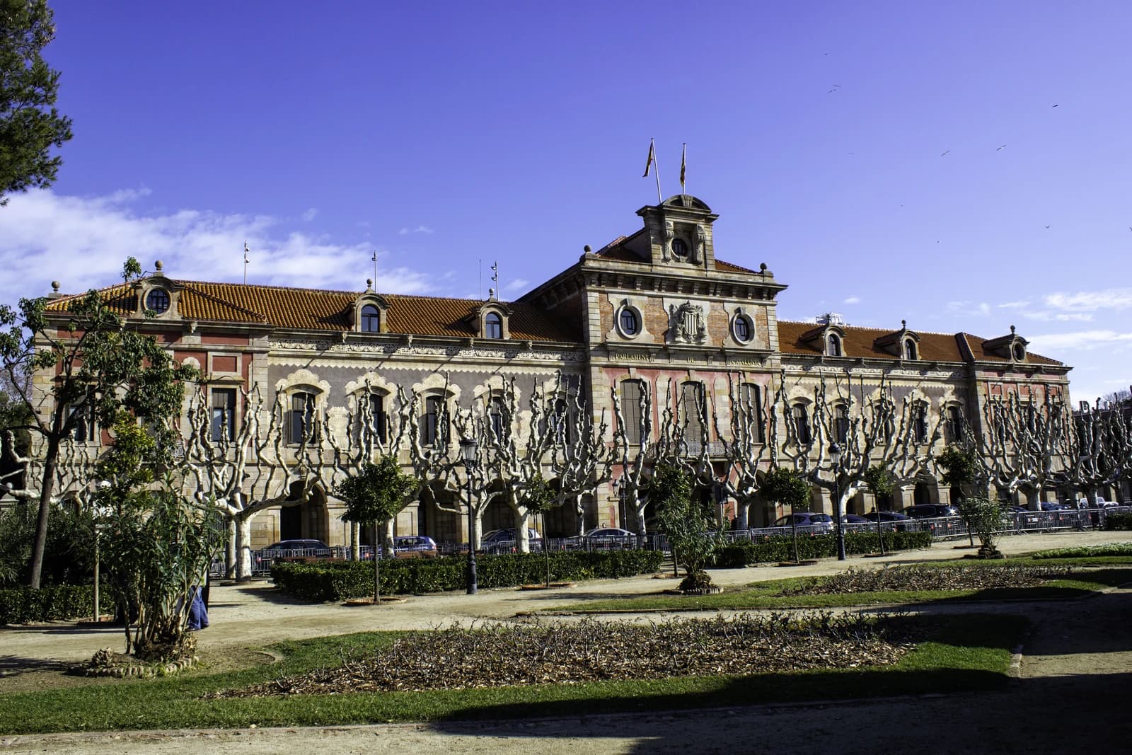 Exterior view of the Parliament of Catalonia building, a large historic structure.