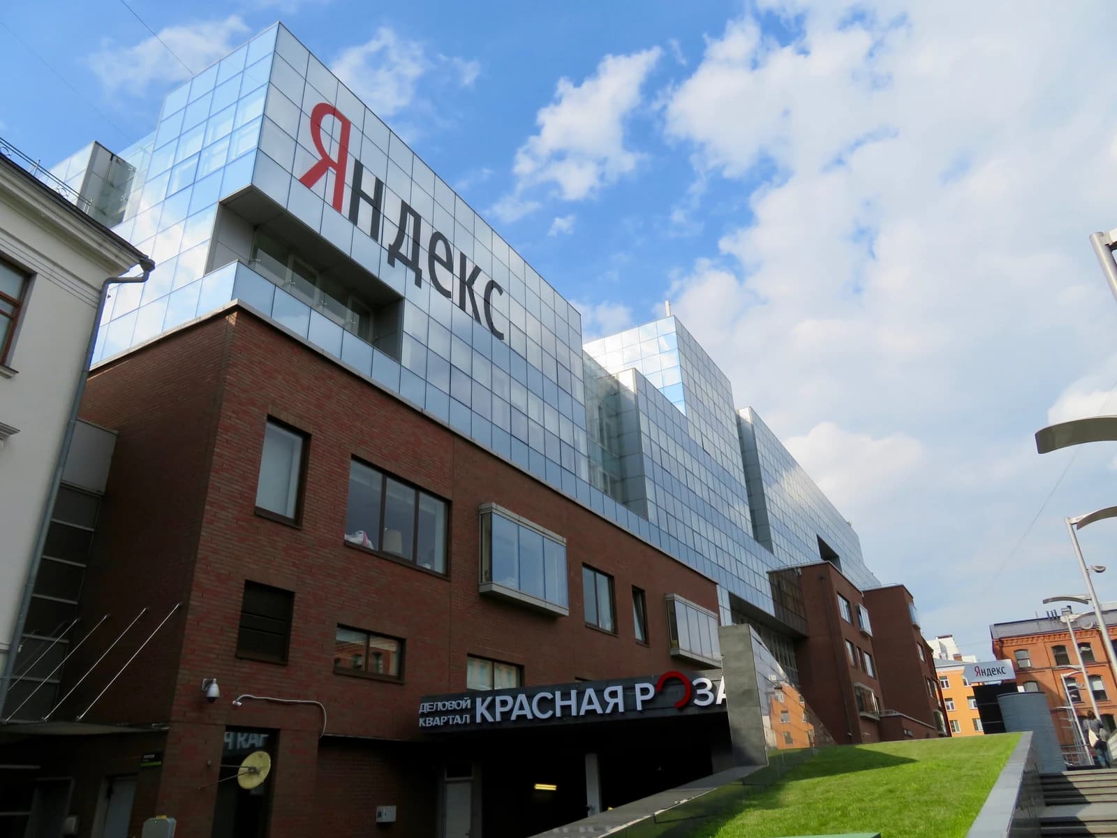 Exterior of the Yandex main office building with the company logo prominently displayed.