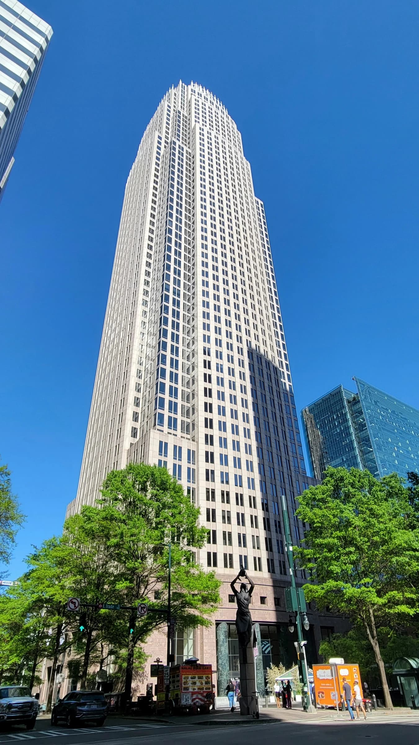 The Bank of America Corporate Center building standing tall against a blue sky.