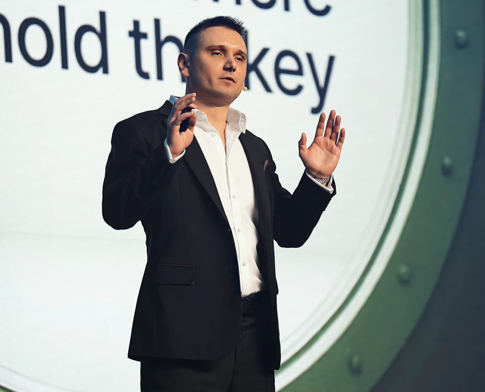 Maksym Sakharov, CEO of WeFi, speaking on stage at the Beyond Banking Conference.