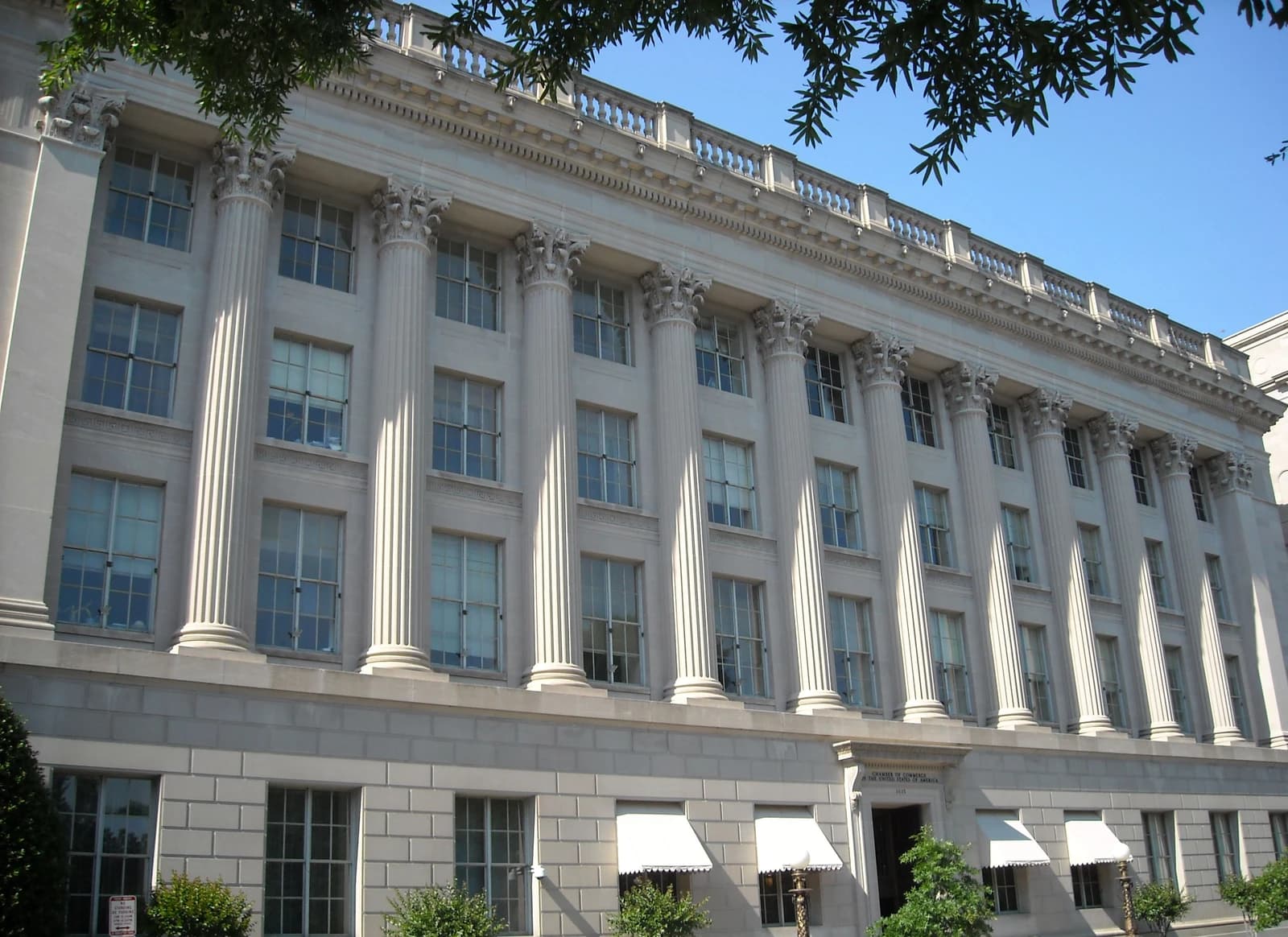 Chamber of Commerce headquarters building, a large white structure with many columns.
