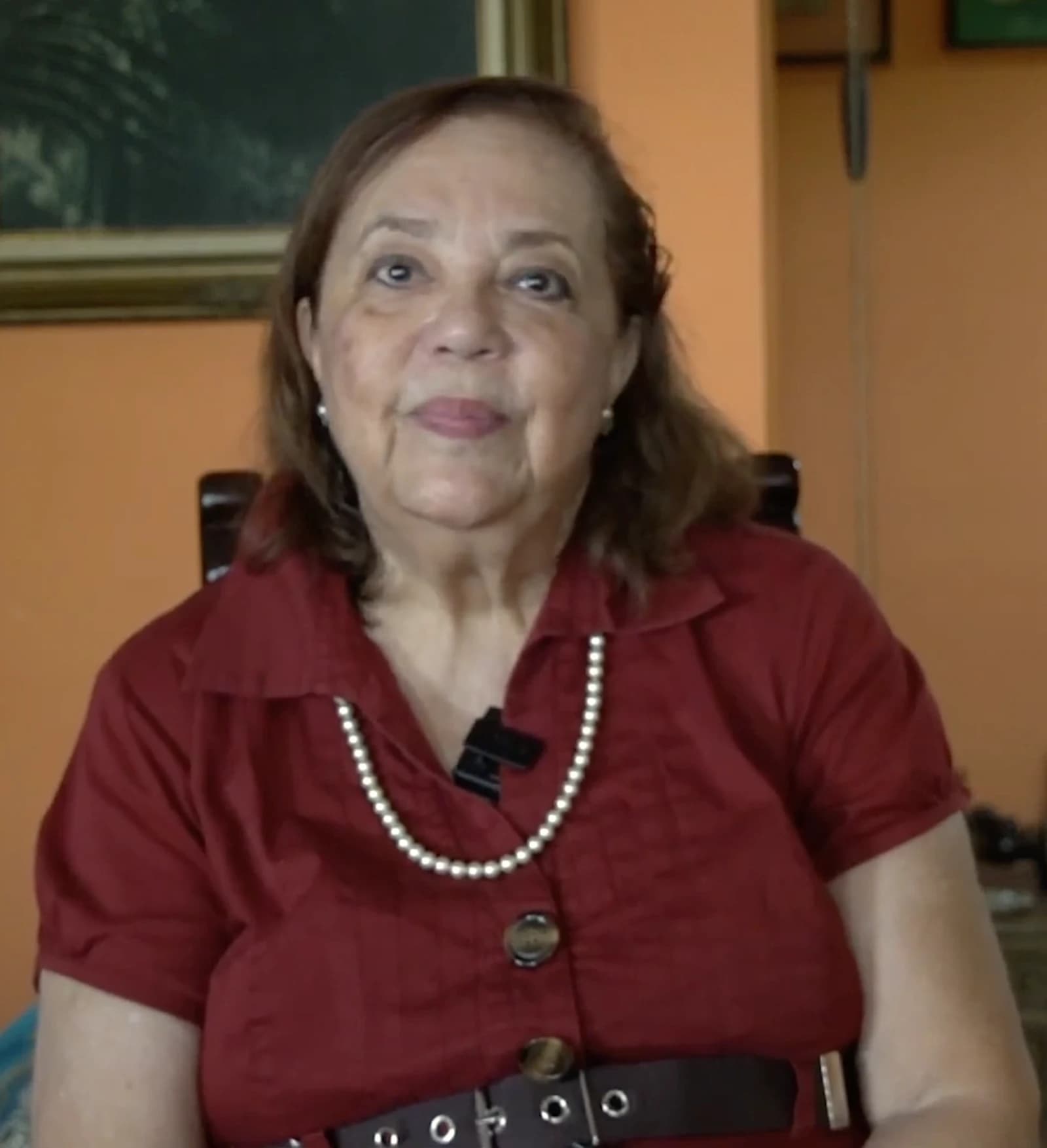 Corina Yoris, a Venezuelan opposition politician, sitting and looking forward.