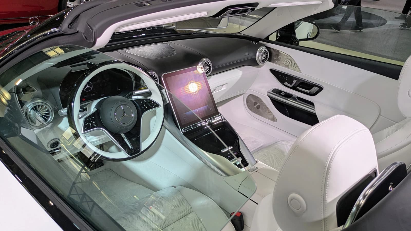 Interior of a white Mercedes-Maybach SL 680 Monogram Series at an auto show.