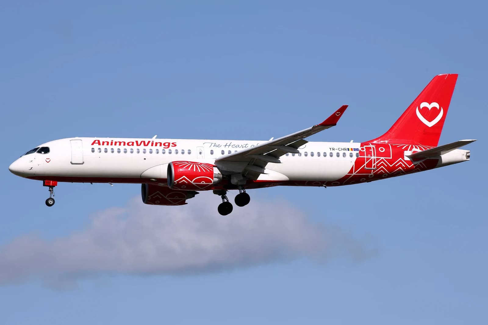 AnimaWings Airbus A220-300 airplane, painted white and red, in flight.