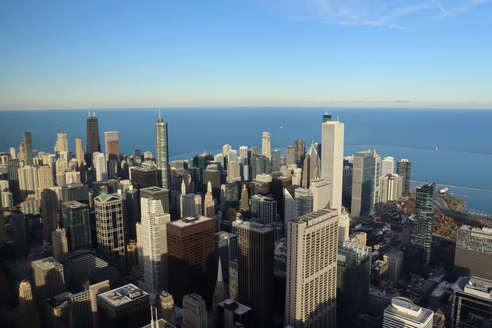 Aerial view of numerous skyscrapers forming the downtown Chicago skyline.