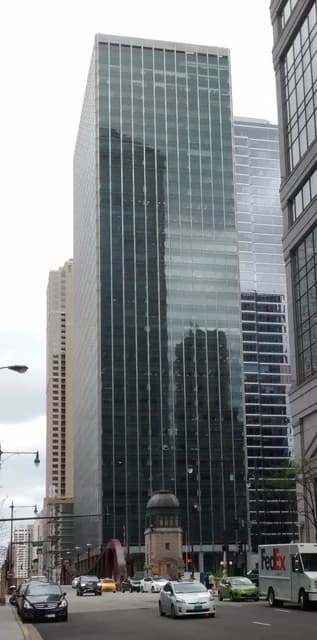 321 North Clark building, a glass office tower, stands in Chicago.