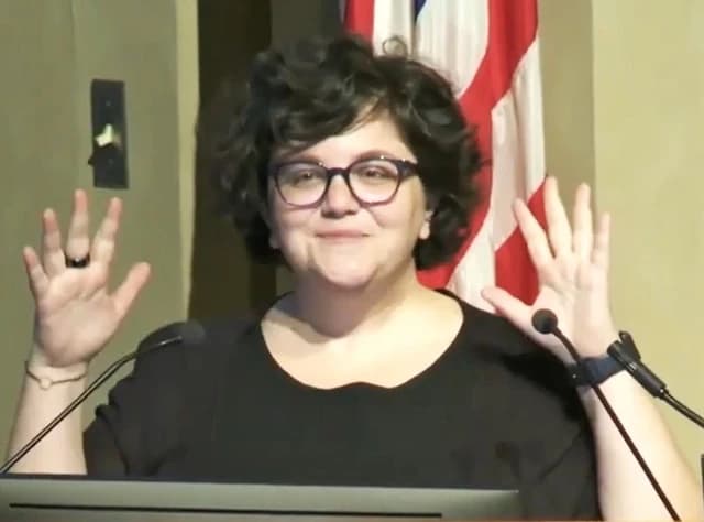 Noémie Elhadad speaks at a podium in the National Library of Medicine.