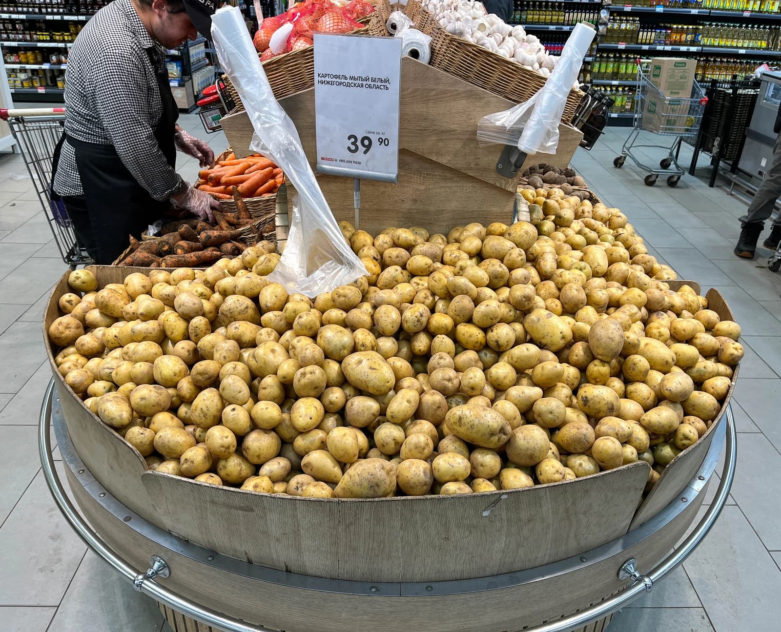 Potatoes in a large bin in a supermarket produce section in Moscow.