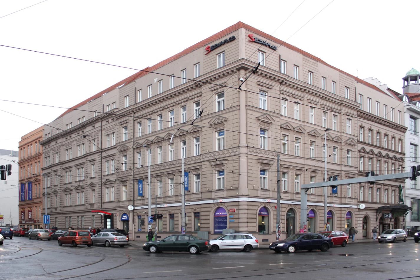 Exterior of the Seznam.cz building with cars on the street in front.