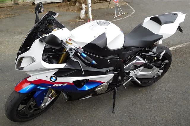 BMW S 1000 RR motorcycle, left side, parked outdoors on asphalt.