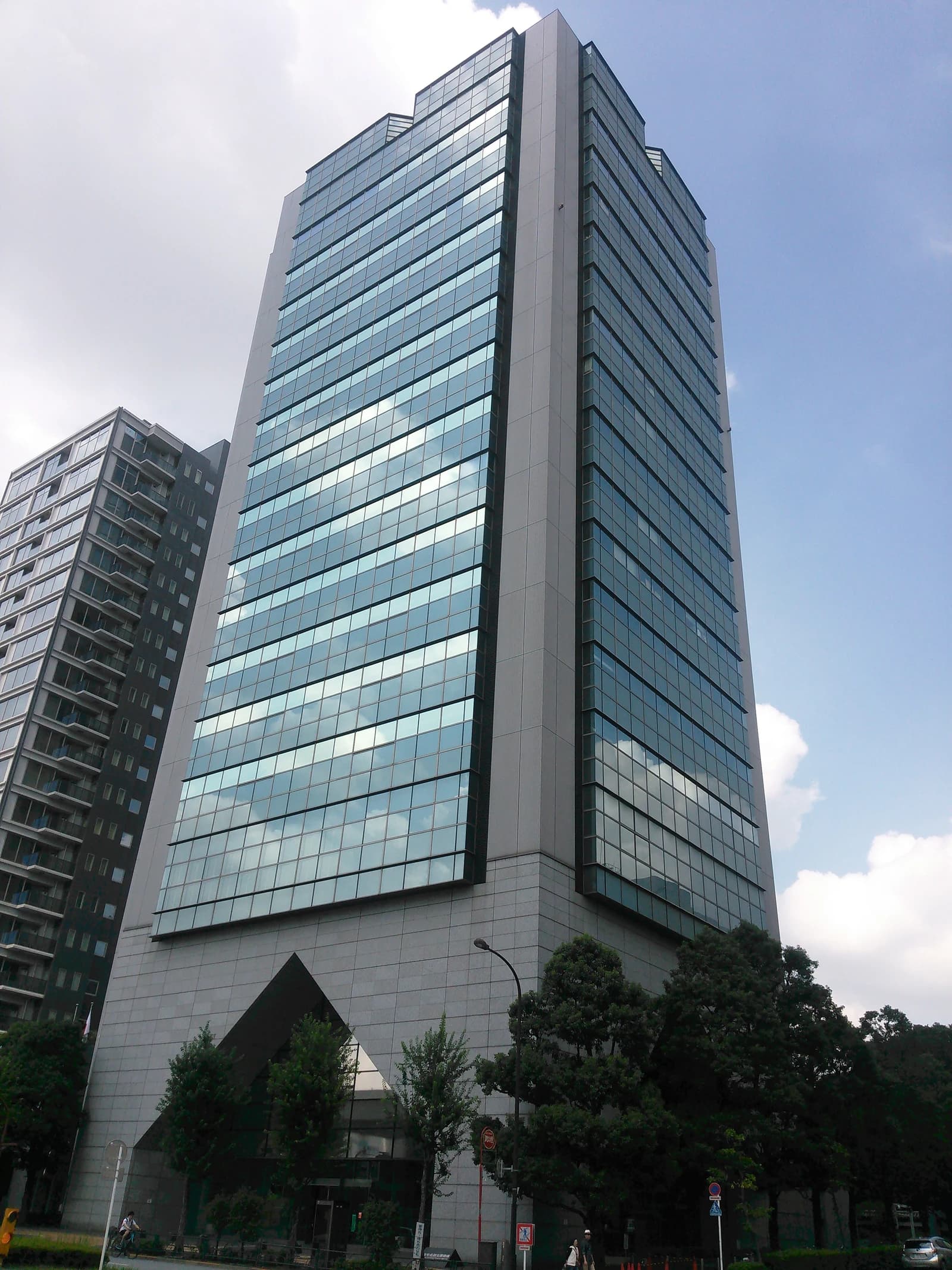 Japan Housing Finance Agency building, a tall modern structure with many glass windows.