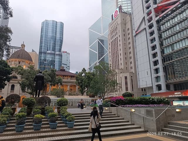 Facades of The Henderson, HSBC HQ, and Bank of China buildings in Hong Kong.