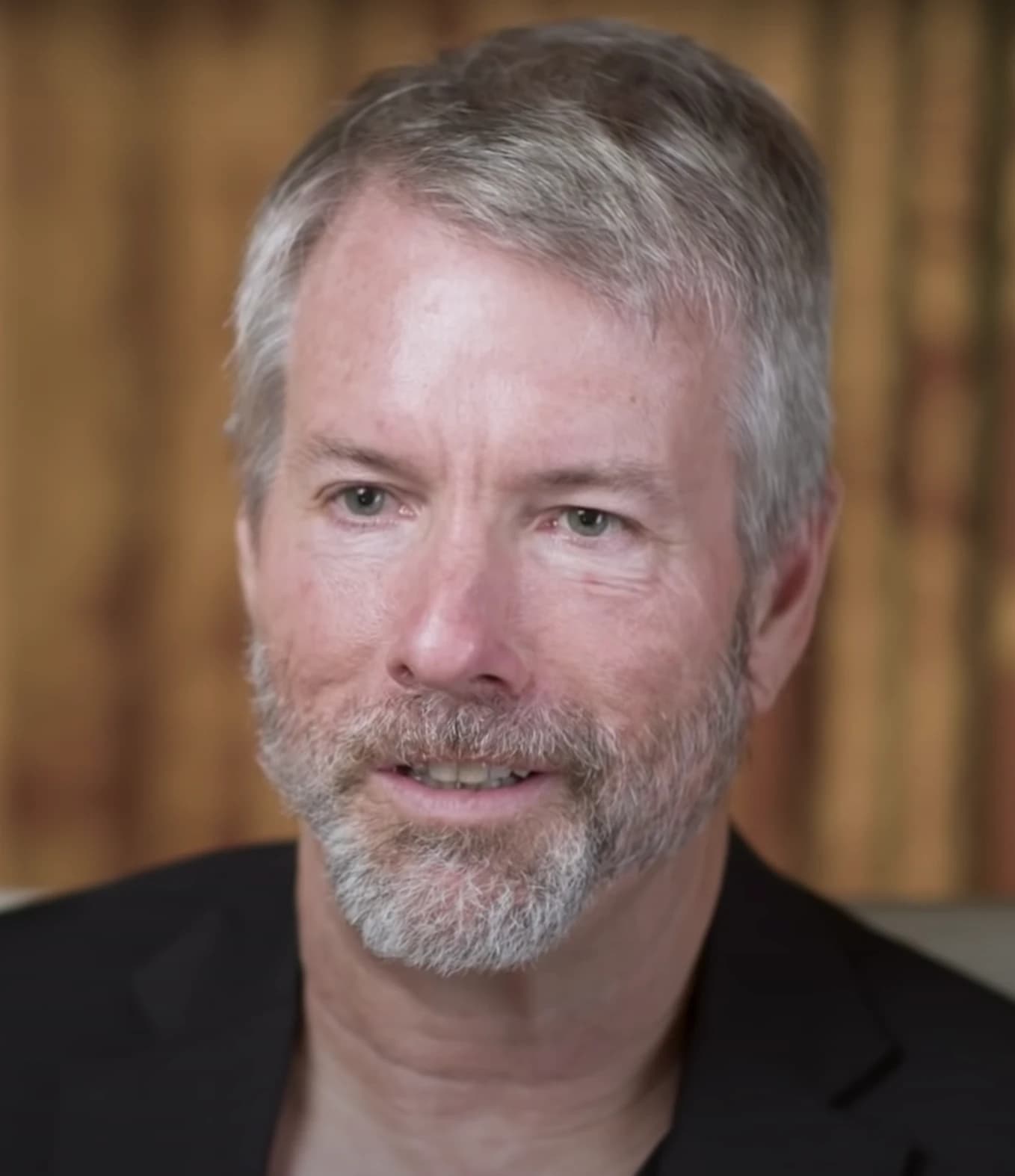 Michael Saylor, CEO of MicroStrategy, looks forward in a medium close-up shot.