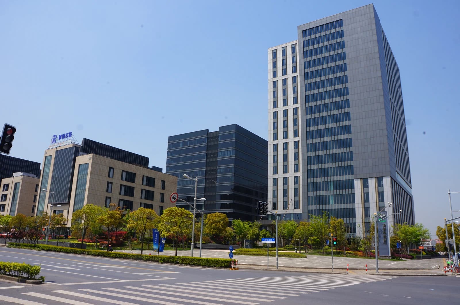 Modern buildings of Wangu Science and Technology Park in China with a clear blue sky.