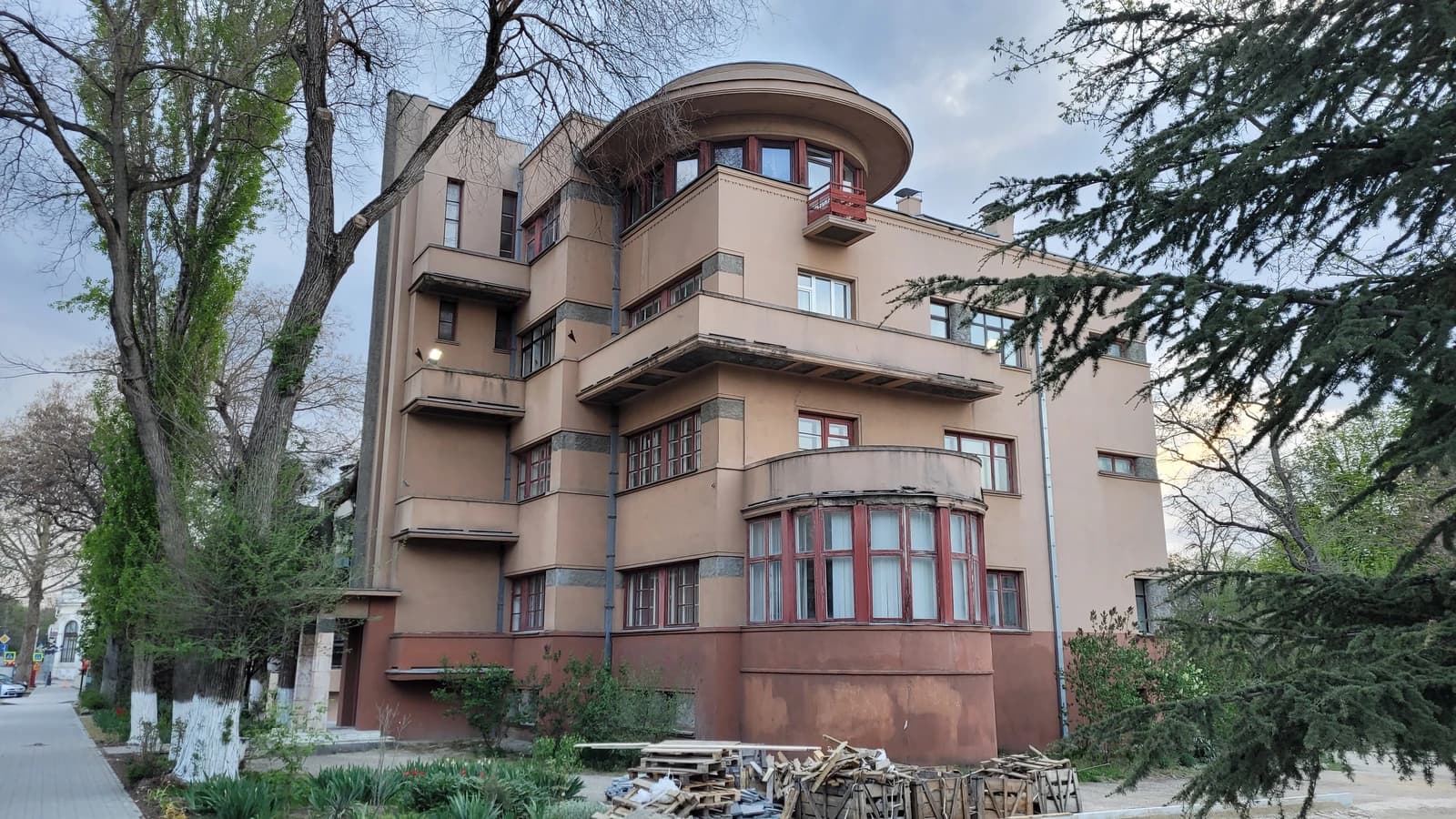 Buildings in Simferopol, Crimea, seen from a street with trees.