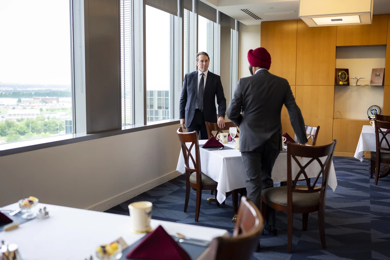 Ajay Banga, World Bank Group President, standing by a window in a meeting room.
