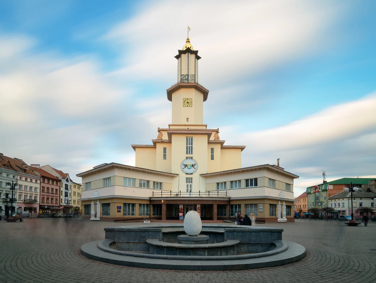 The Town Hall of Ivano-Frankivsk, Ukraine, under a cloudy sky.