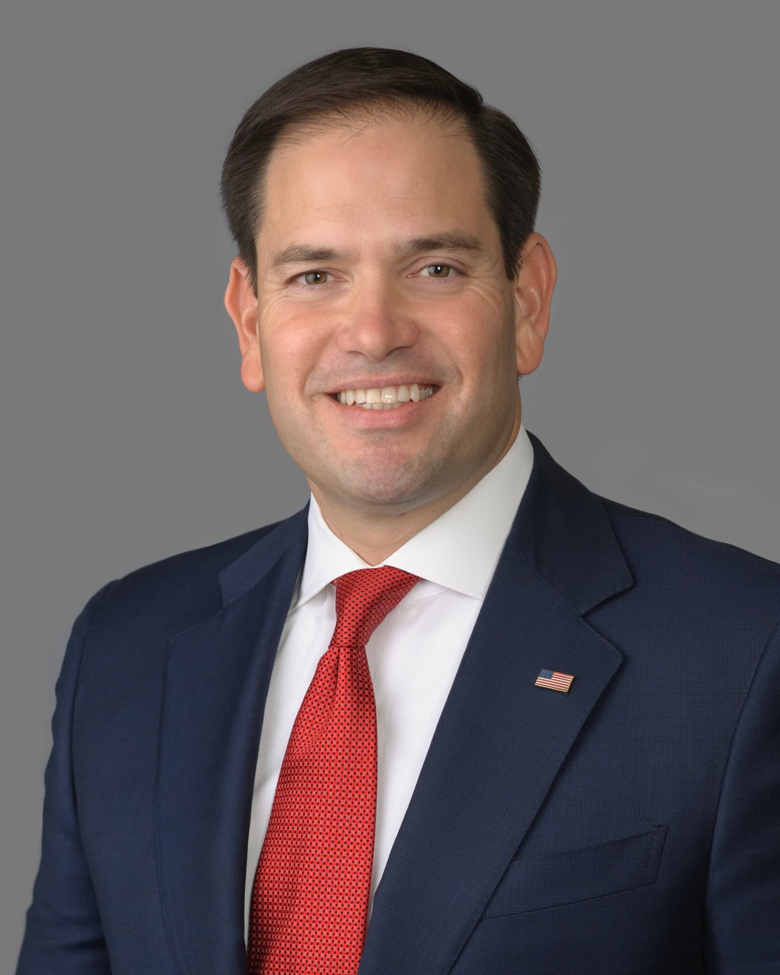 Senator Marco Rubio smiling, facing forward for an official portrait.