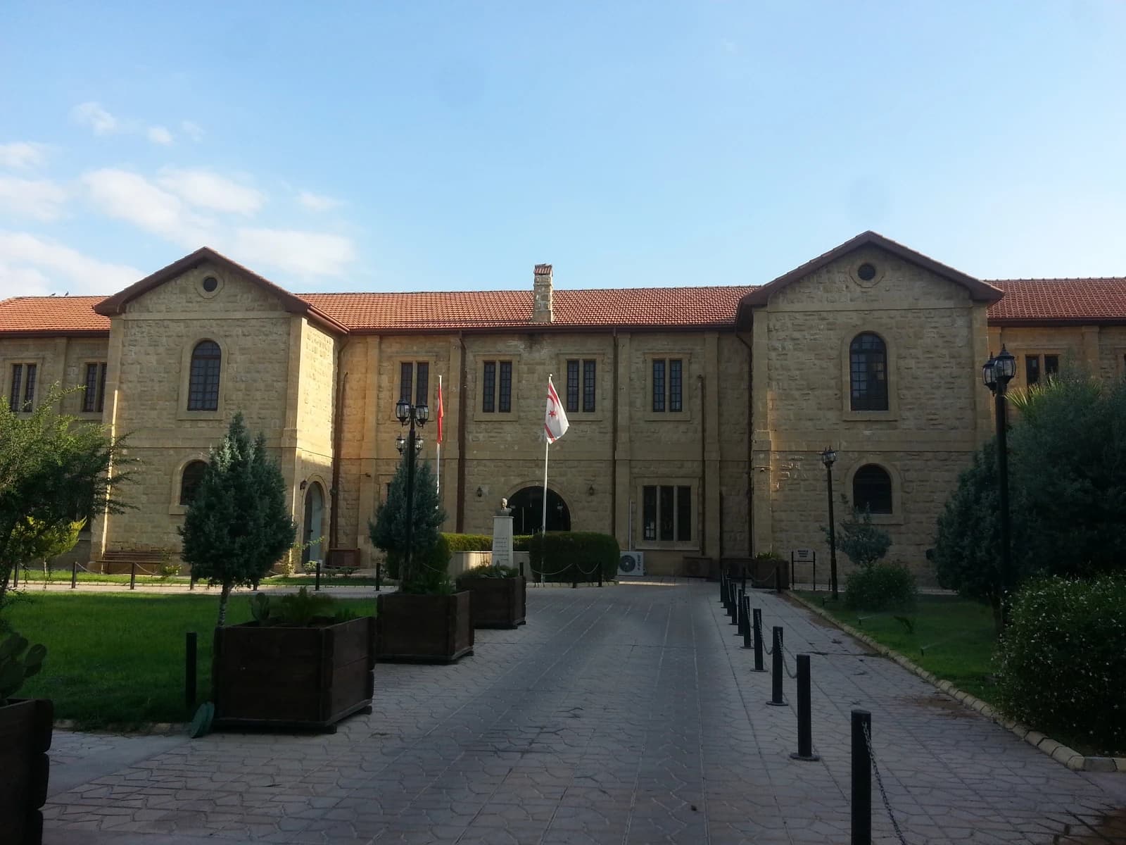 Northern Cyprus Ministry of Tourism building, a historical stone structure, under clear sky.
