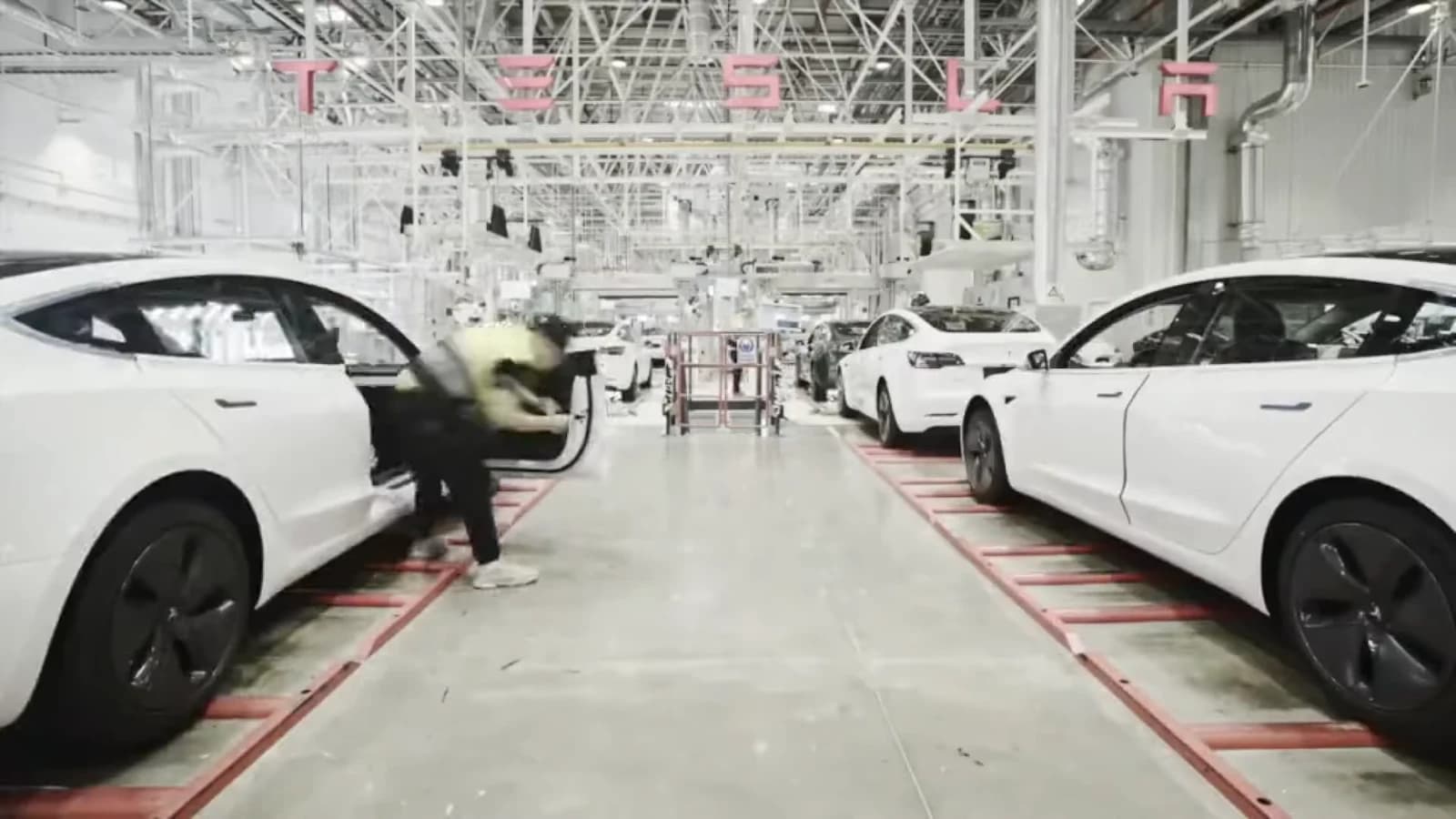Tesla Model 3 cars being assembled on a production line at Gigafactory Shanghai.
