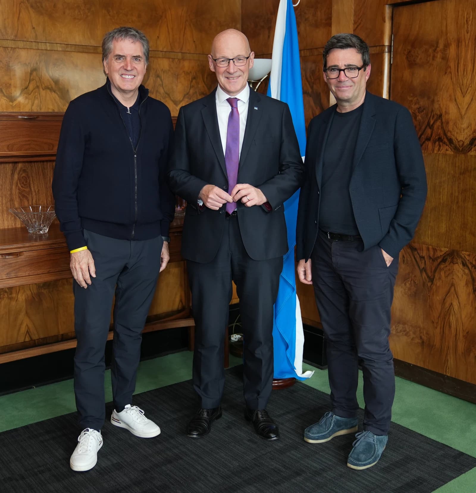 First Minister John Swinney, Mayor of Manchester Andy Burnham, and Mayor of Liverpool Steve Rotheram standing together.