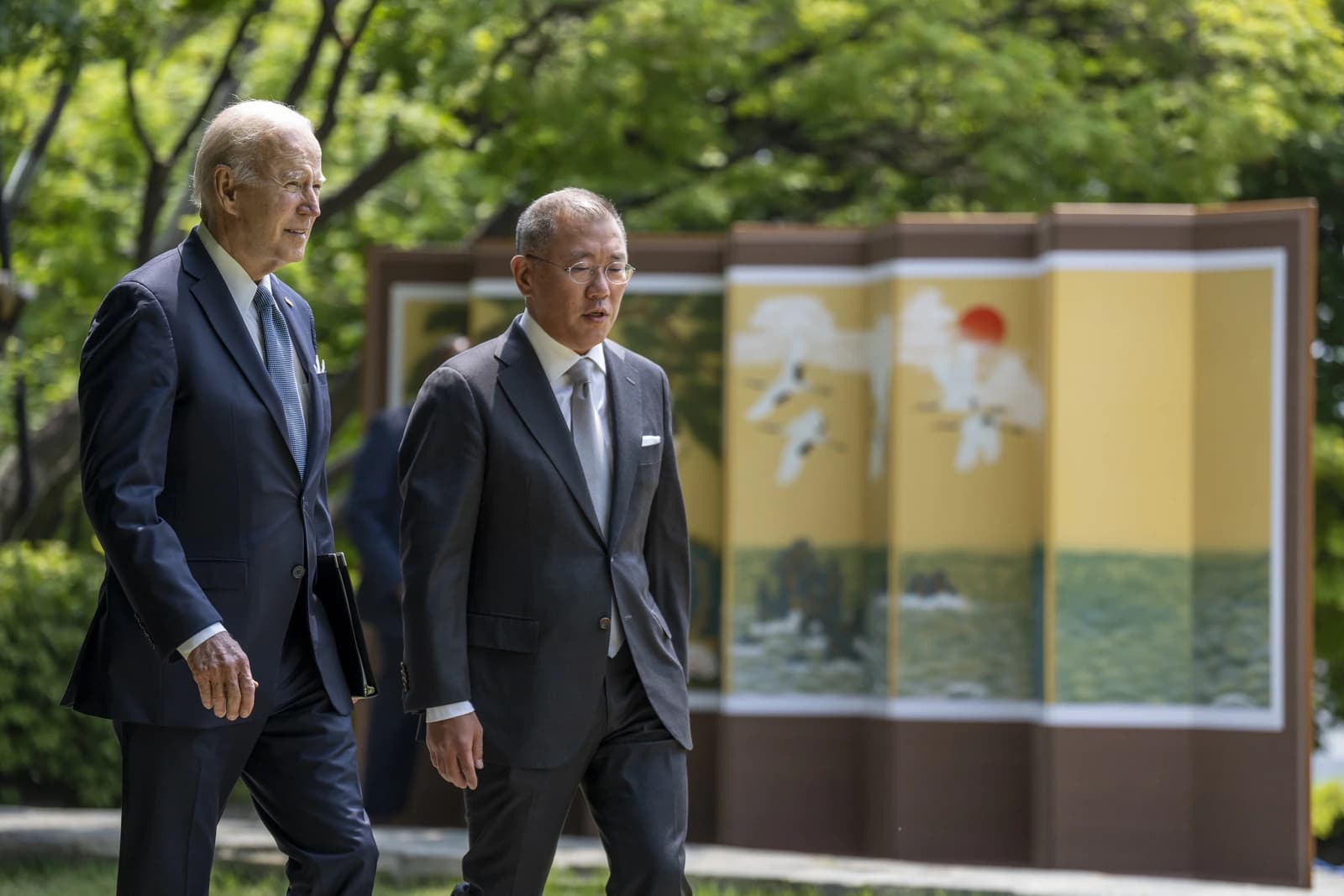 President Joe Biden and Hyundai Motor Group Chairman Euisun Chung walking side-by-side.