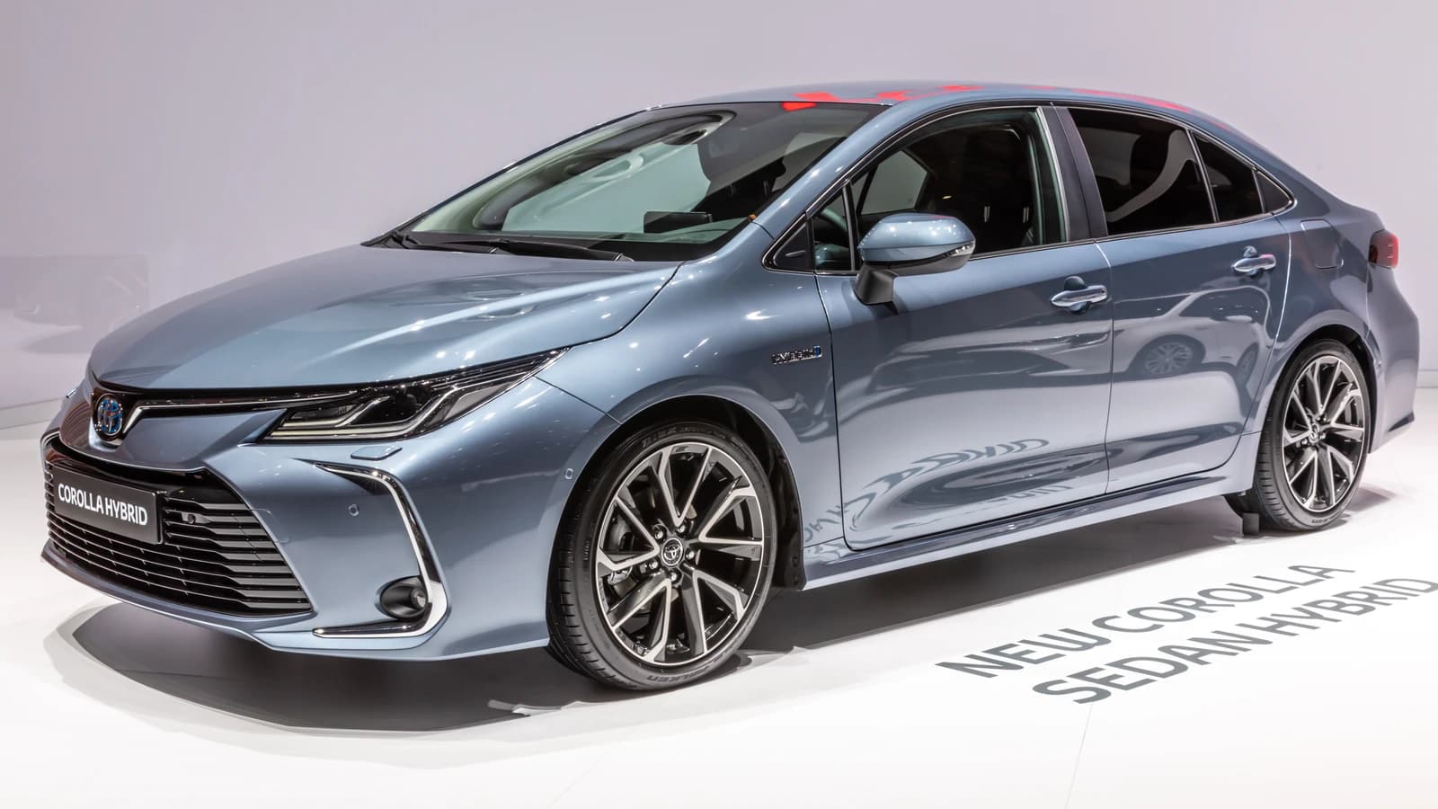 Grey Toyota Corolla Hybrid Sedan displayed at the Geneva International Motor Show in 2019.