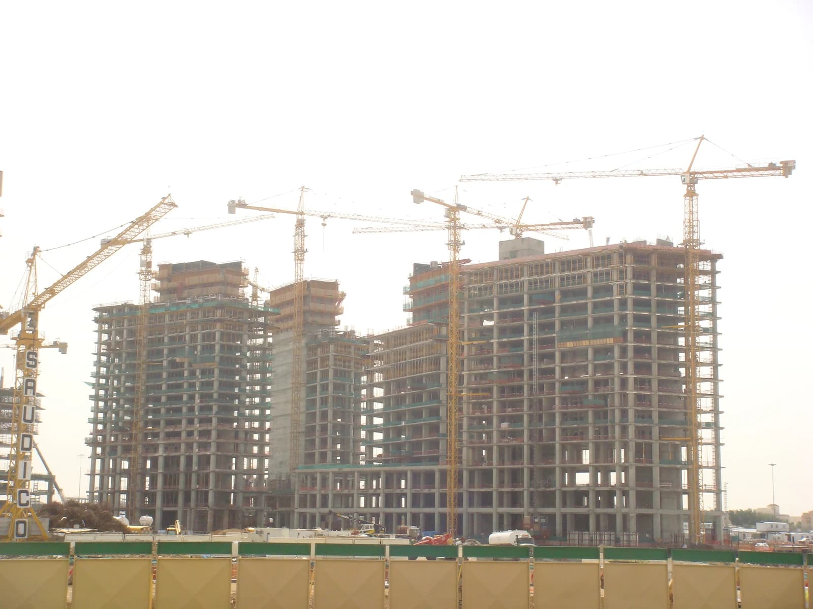 Construction cranes and unfinished high-rise buildings at the King Abdullah Financial District.
