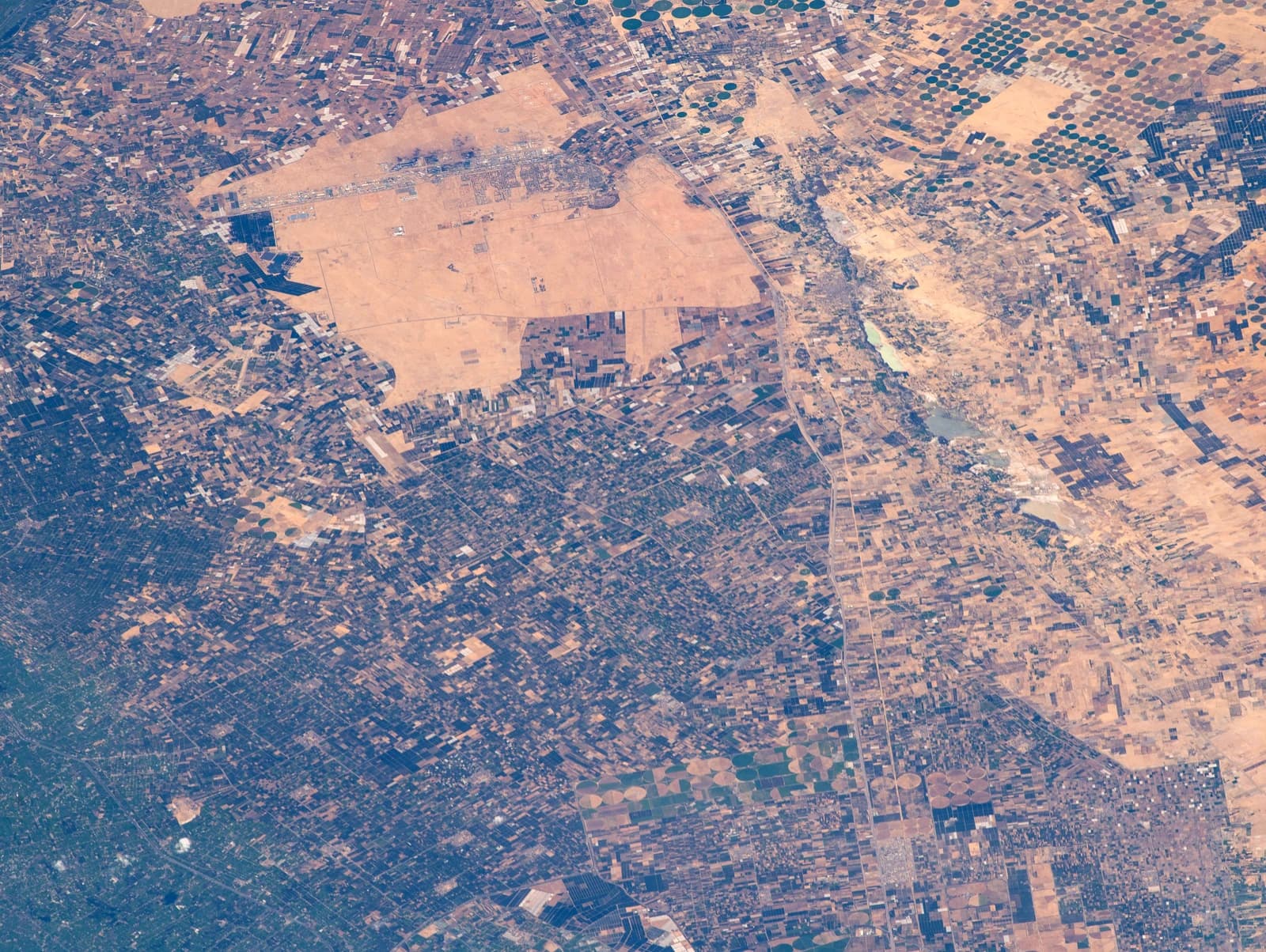Aerial view of Sadat City, Wadi an-Natrun, Al Nubaria, and the Nile Delta in Egypt.