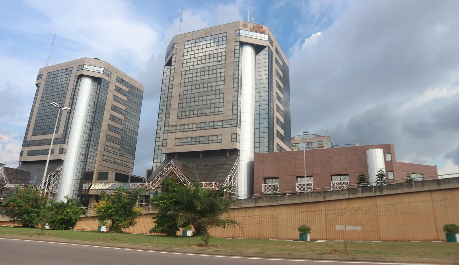 Exterior view of the Nigerian National Petroleum Corporation headquarters buildings and surrounding area.