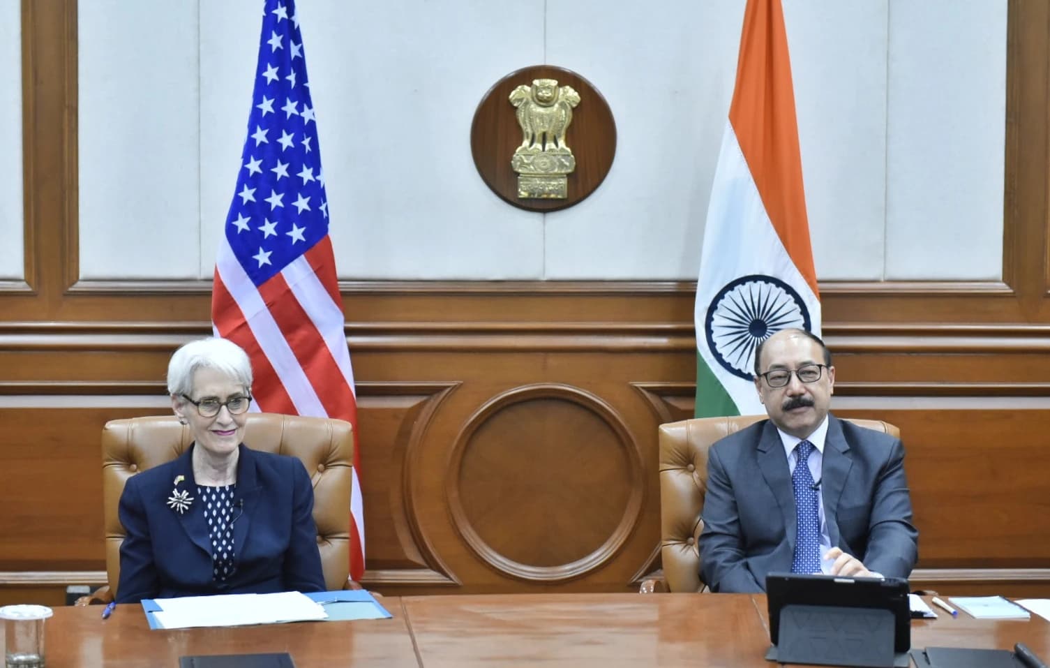 Deputy Secretary of State Wendy Sherman and Foreign Secretary Harsh Vardhan Shringla seated at a table.