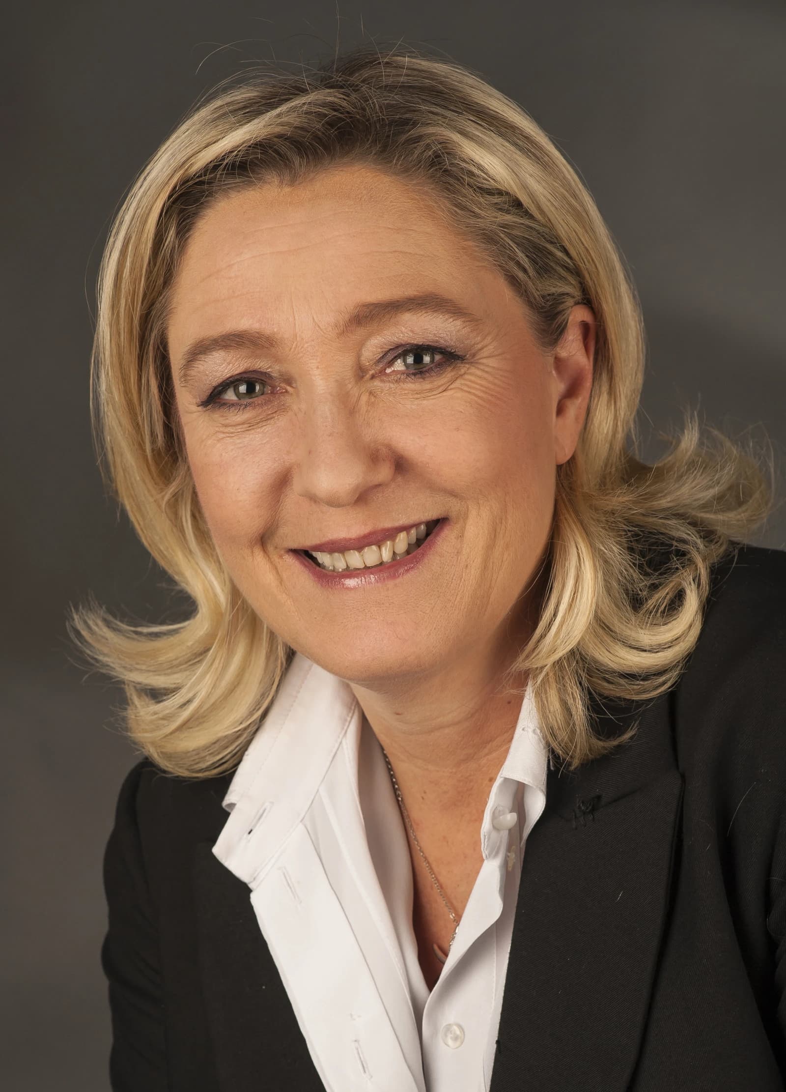 Marine Le Pen, French politician, smiling and looking directly at the camera.