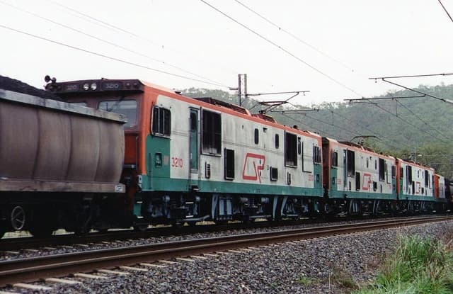 Queensland Rail electric locomotives 3210 and others pulling a loaded coal train.