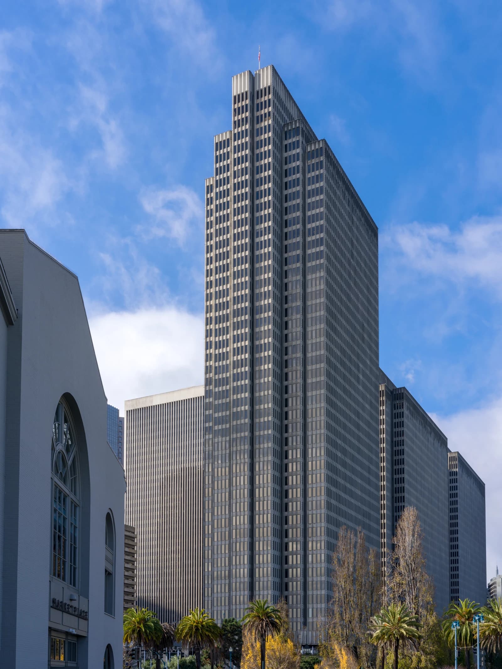 Skyscrapers in San Francisco's Financial District under a blue sky with clouds.