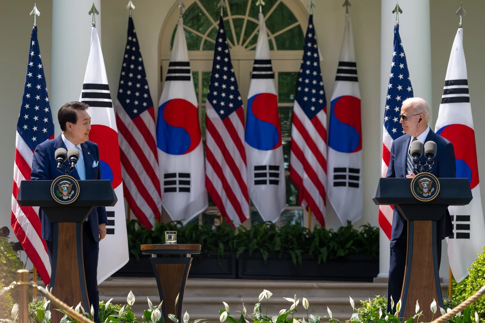 President Joe Biden and President Yoon Suk Yeol at a joint press conference outdoors.