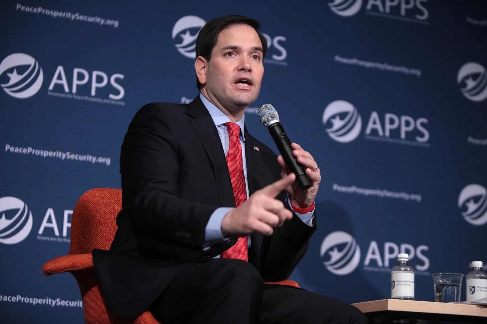 Marco Rubio, US Secretary of State, speaking at a podium with a microphone.