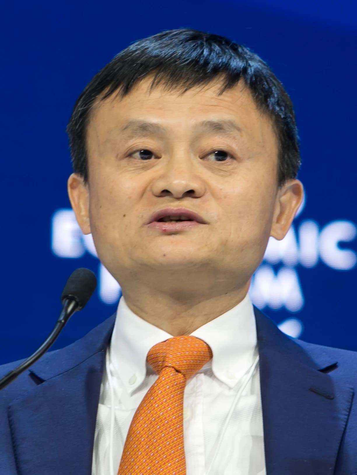 Jack Ma, co-founder of Alibaba, speaking at a microphone.