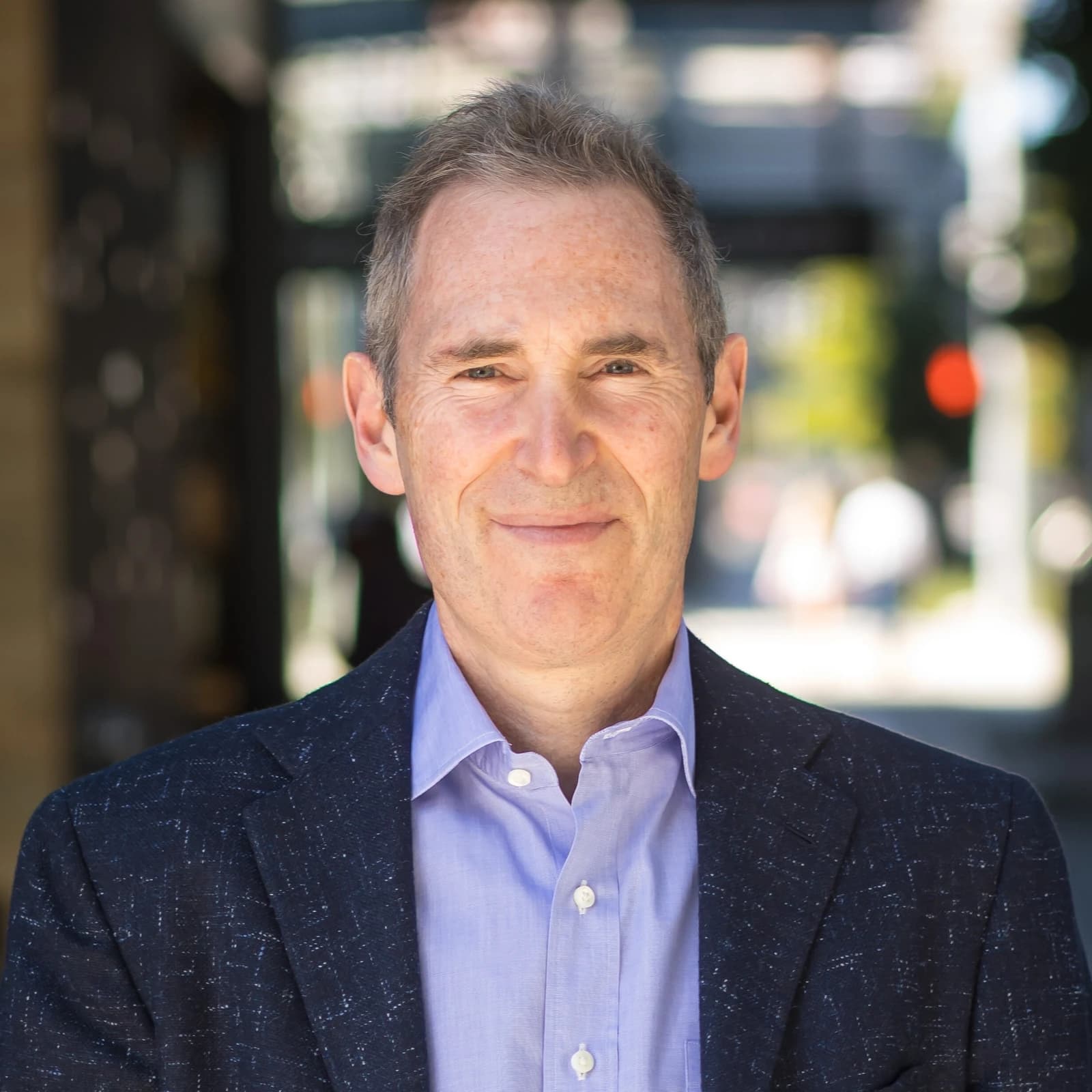 Andy Jassy, CEO of Amazon, smiling and looking directly at the camera.
