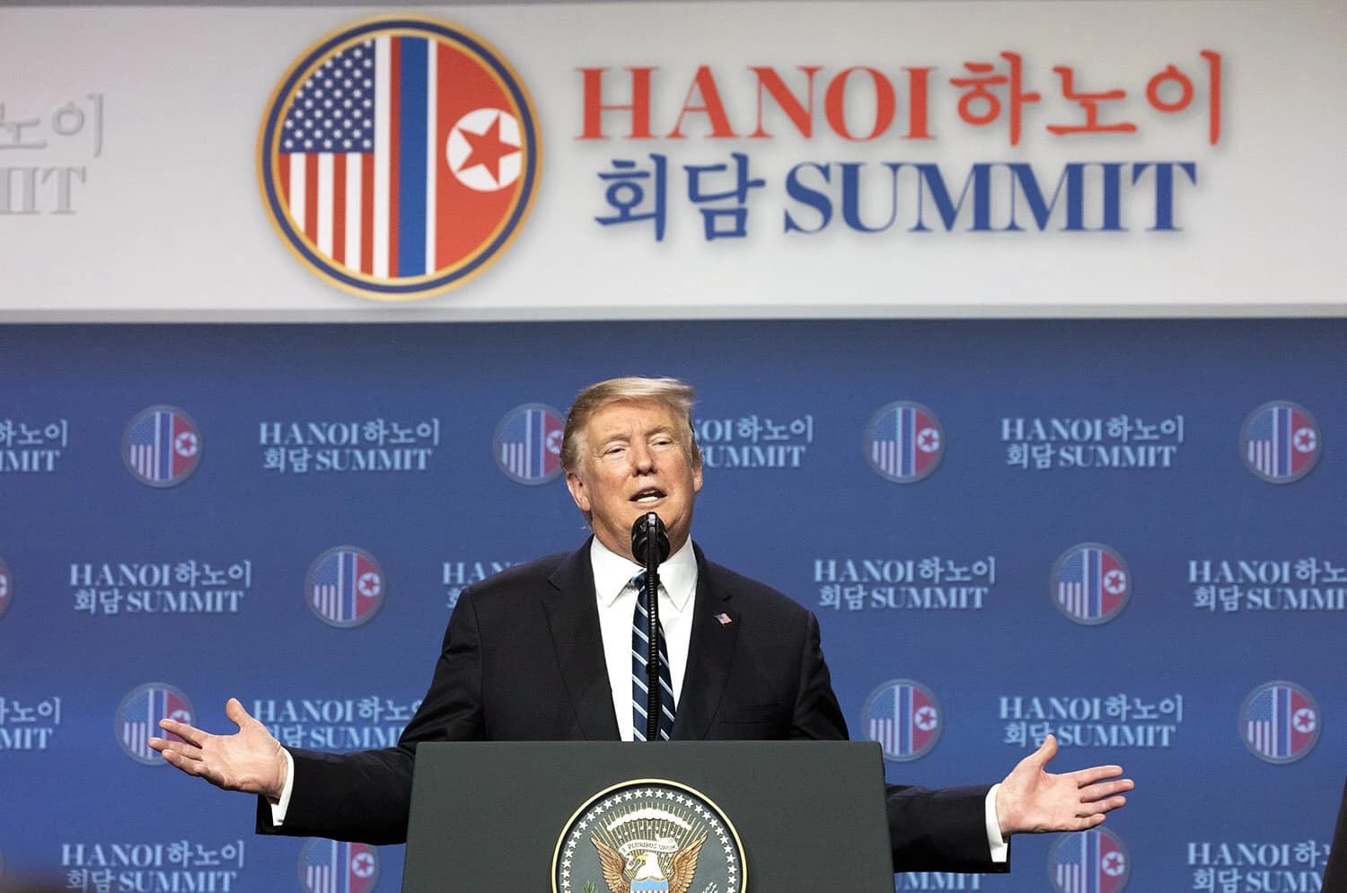 Donald Trump, President of the United States, speaking at a podium with hands open.