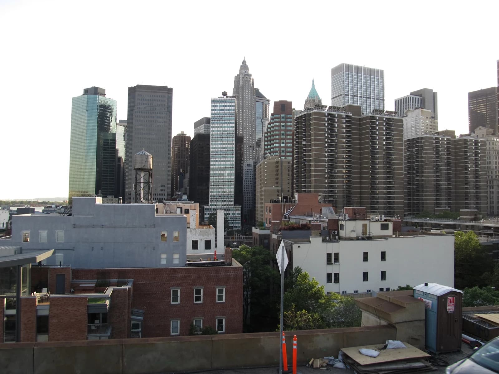 Manhattan Financial District skyline, with skyscrapers and residential buildings, viewed from the Brooklyn Bridge.